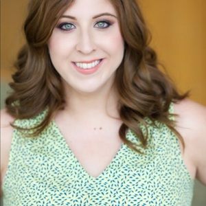 Beautiful yellow sleeveless top with blue print